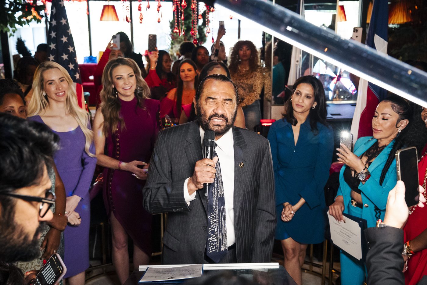 Congressman speaking at a Houston event — speaker and
        podium photography